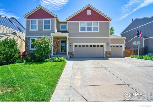 view of front of house featuring stone siding, concrete driveway, an attached garage, and a garage
