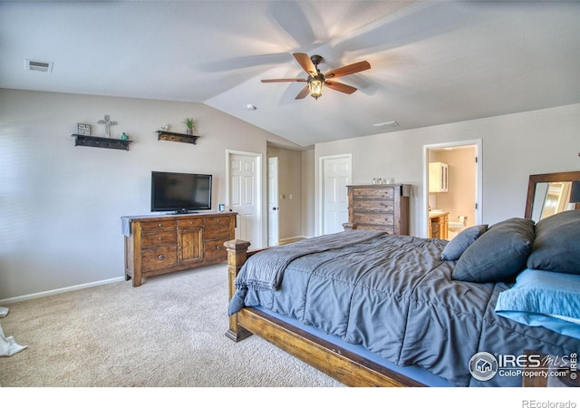 carpeted bedroom with vaulted ceiling, baseboards, connected bathroom, and ceiling fan