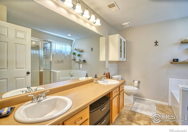 bathroom with a bath, toilet, double vanity, and a shower stall