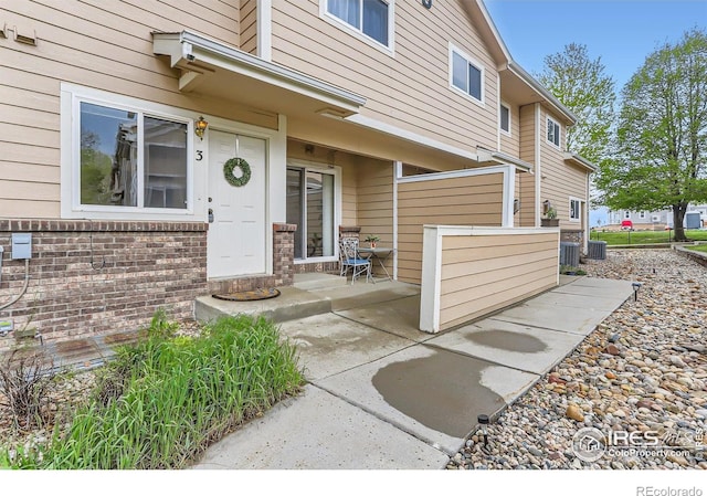 doorway to property with cooling unit