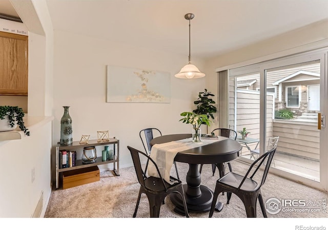 dining area with light carpet
