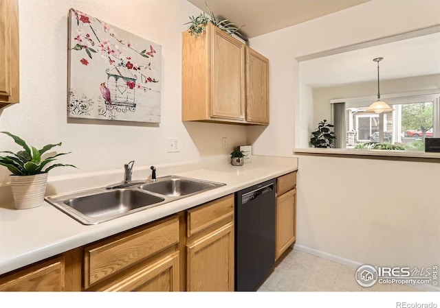 kitchen with dishwasher, a sink, light countertops, baseboards, and light brown cabinets