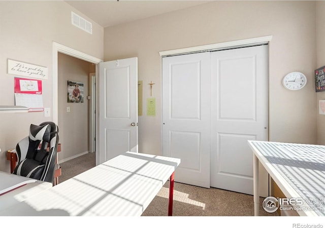 bedroom with carpet floors and a closet