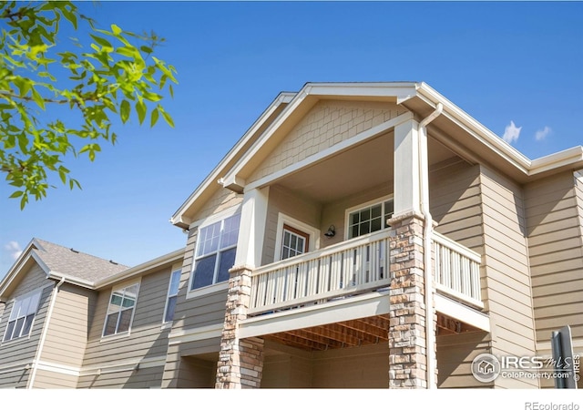 view of property exterior featuring a balcony