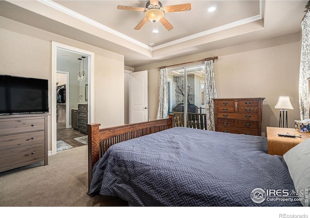 4609 Freehold Dr, Windsor, CO 80550 - bedroom with carpet floors, ornamental molding, a tray ceiling, a ceiling fan, and ensuite bathroom