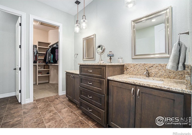 4609 Freehold Dr, Windsor, CO 80550 - bathroom with two vanities and a spacious closet