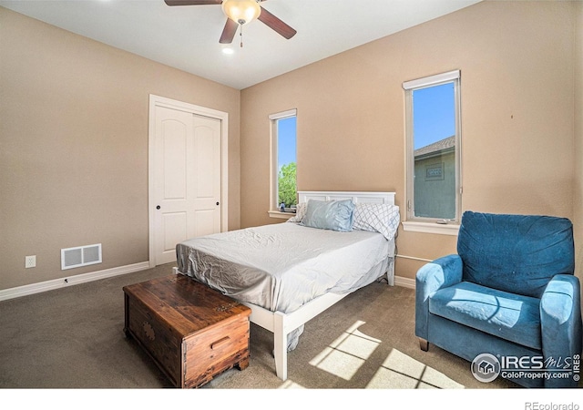 4609 Freehold Dr, Windsor, CO 80550 - carpeted bedroom with baseboards and ceiling fan