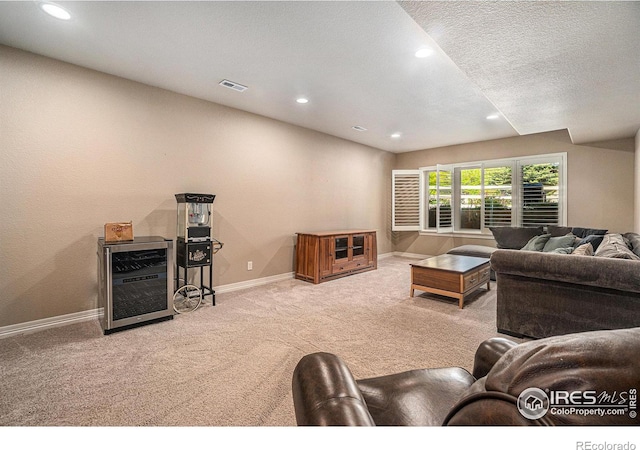 4609 Freehold Dr, Windsor, CO 80550 - carpeted living room with recessed lighting and a textured ceiling