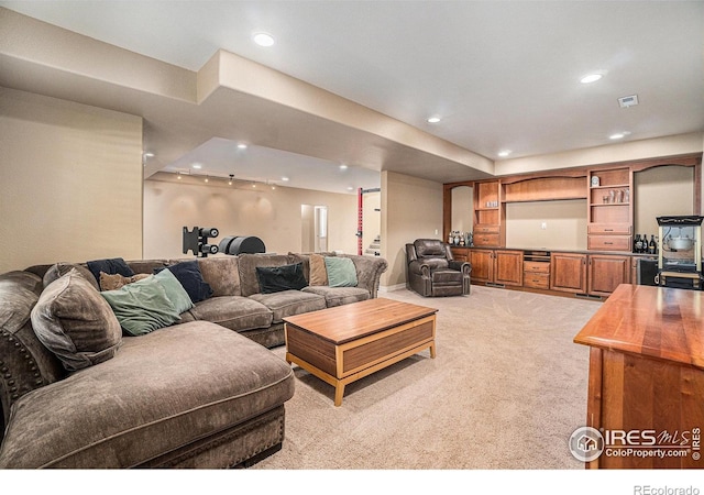 4609 Freehold Dr, Windsor, CO 80550 - living area with light colored carpet and recessed lighting
