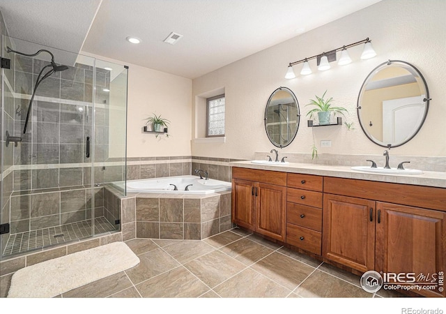 4609 Freehold Dr, Windsor, CO 80550 - full bathroom with a shower stall, a bath, and double vanity