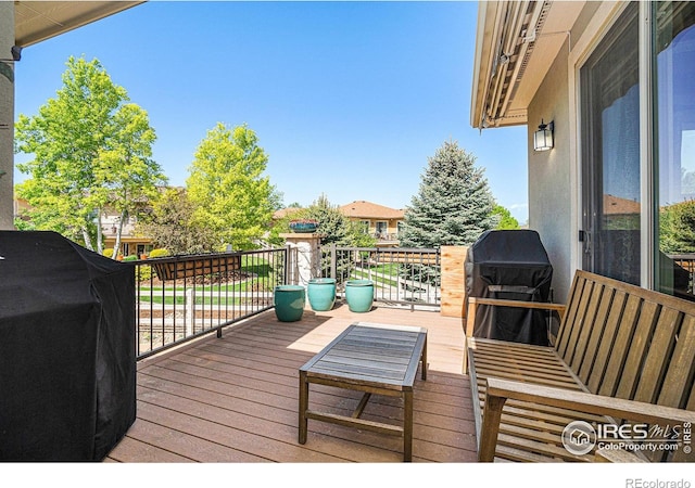4609 Freehold Dr, Windsor, CO 80550 - wooden deck featuring a grill
