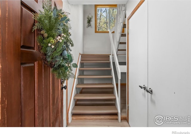 4888 Silver Spruce Ln, Evergreen, CO 80439 - stairs with wood finished floors