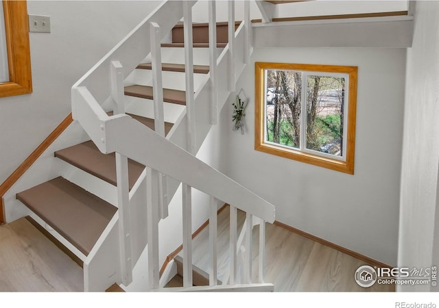 4888 Silver Spruce Ln, Evergreen, CO 80439 - stairway with wood finished floors and baseboards