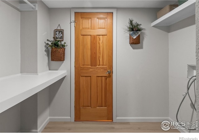 4888 Silver Spruce Ln, Evergreen, CO 80439 - mudroom featuring light wood-style flooring and baseboards