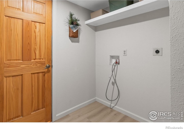 4888 Silver Spruce Ln, Evergreen, CO 80439 - laundry room with hookup for a washing machine, light wood-type flooring, electric dryer hookup, and baseboards