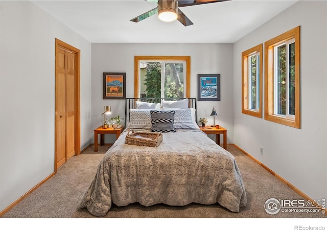4888 Silver Spruce Ln, Evergreen, CO 80439 - bedroom featuring light colored carpet, baseboards, and ceiling fan