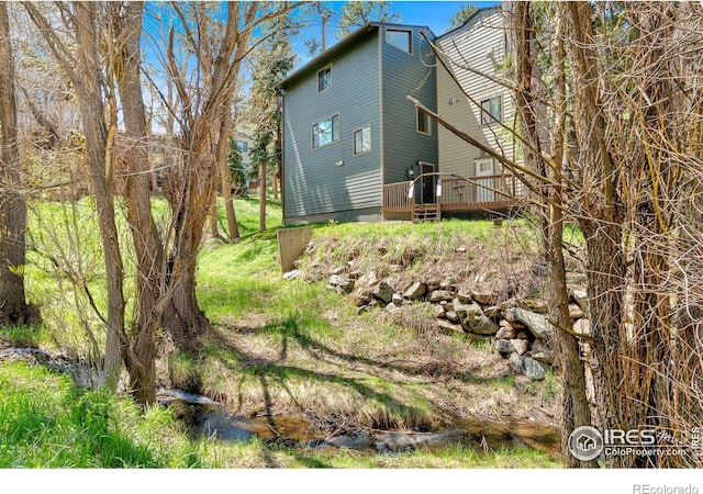 4888 Silver Spruce Ln, Evergreen, CO 80439 - view of side of property with a deck