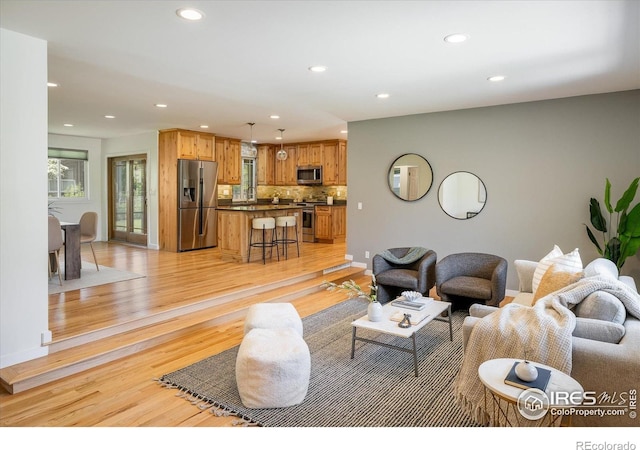 4760 Lee Cir, Boulder, CO 80303 - living area featuring recessed lighting, light wood-style flooring, and baseboards