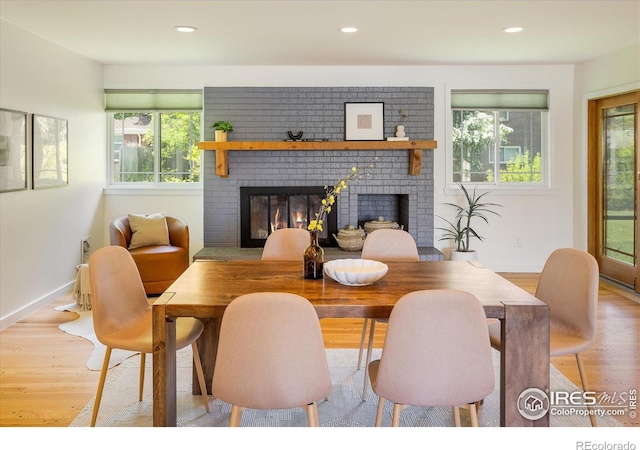 4760 Lee Cir, Boulder, CO 80303 - dining space with a fireplace, healthy amount of natural light, light wood-style floors, recessed lighting, and baseboards