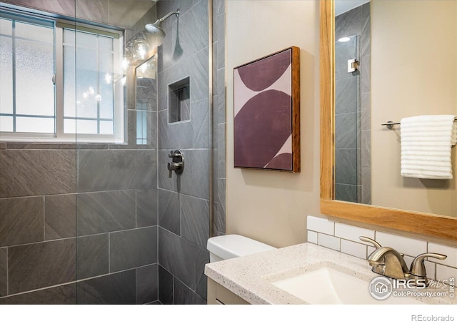4760 Lee Cir, Boulder, CO 80303 - bathroom with a tile shower, vanity, and toilet