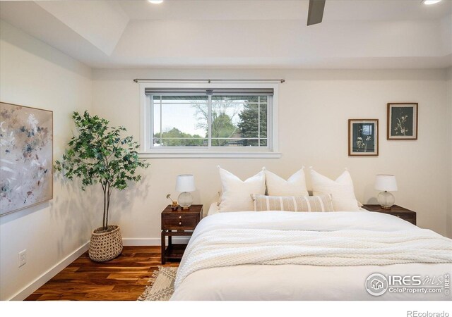 4760 Lee Cir, Boulder, CO 80303 - bedroom featuring wood finished floors, a raised ceiling, and baseboards
