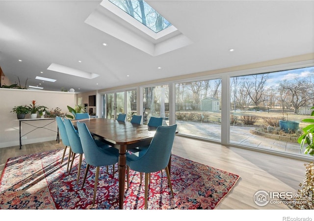 819 Gapter Rd, Boulder, CO 80303 - dining space featuring a skylight, wood finished floors, and recessed lighting