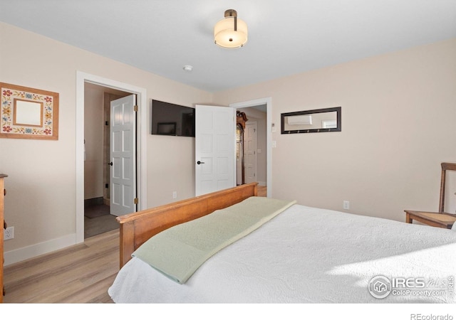 819 Gapter Rd, Boulder, CO 80303 - bedroom with light wood finished floors and baseboards
