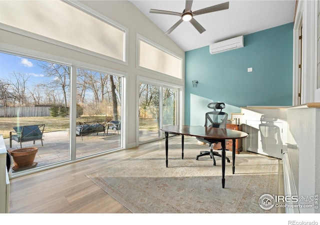819 Gapter Rd, Boulder, CO 80303 - home office featuring a wall unit AC, a ceiling fan, wood finished floors, and high vaulted ceiling