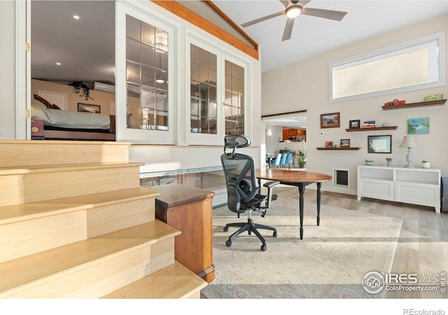 819 Gapter Rd, Boulder, CO 80303 - office area featuring wood finished floors, a ceiling fan, vaulted ceiling, and a wall mounted air conditioner
