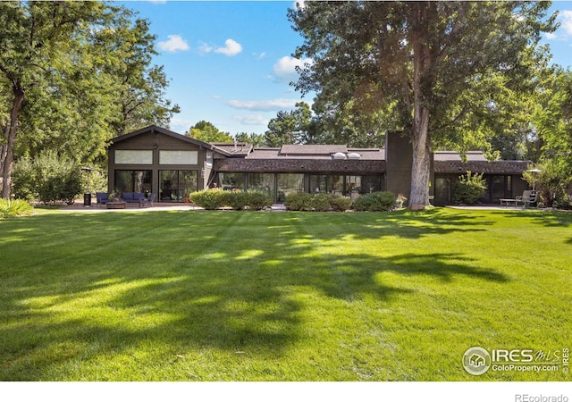 819 Gapter Rd, Boulder, CO 80303 - rear view of house featuring a yard and a patio