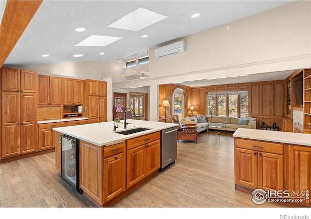 819 Gapter Rd, Boulder, CO 80303 - kitchen featuring a sink, dishwasher, a wall mounted air conditioner, beverage cooler, and a skylight