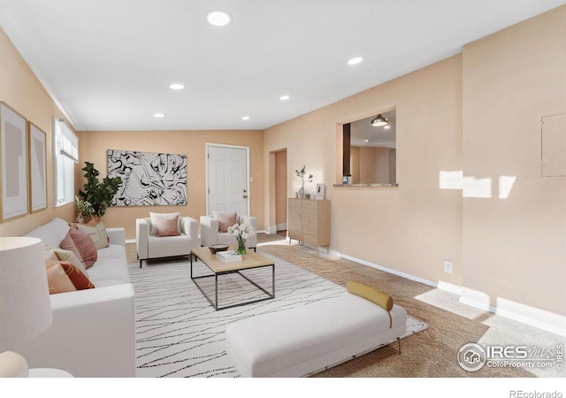 living room with carpet, recessed lighting, and baseboards