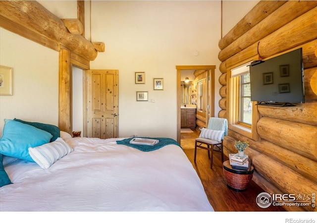 351 County Road 128n, Nederland, CO 80466 - bedroom with rustic walls, wood finished floors, a towering ceiling, and ensuite bathroom