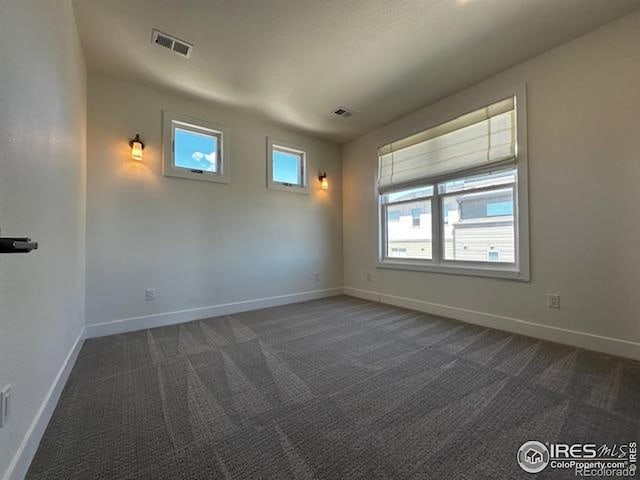 410 Superior Dr, Superior, CO 80027 - empty room featuring baseboards and dark carpet