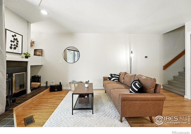 5016 Buckingham Rd Unit 4, Boulder, CO 80301 - living area featuring stairs, wood finished floors, a fireplace, and recessed lighting