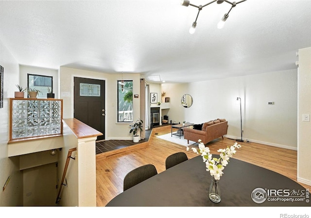 5016 Buckingham Rd Unit 4, Boulder, CO 80301 - living area featuring wood finished floors and a glass covered fireplace