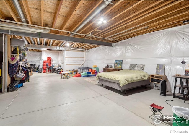 bedroom featuring concrete floors