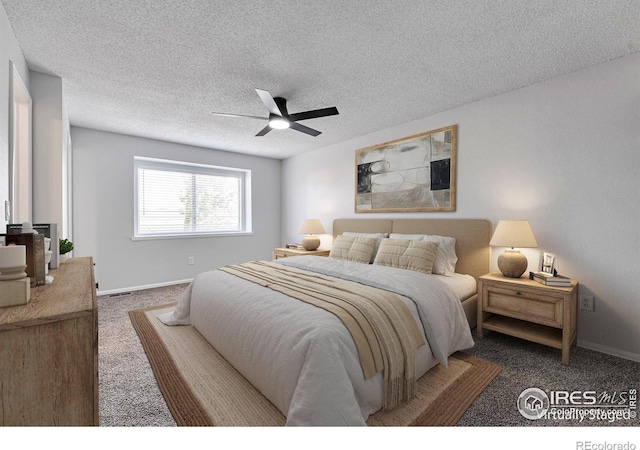 12525 E Tennessee Cir Unit E, Aurora, CO 80012 - bedroom featuring carpet flooring, baseboards, a textured ceiling, and a ceiling fan