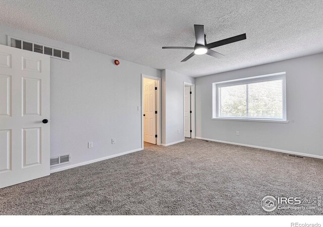 12525 E Tennessee Cir Unit E, Aurora, CO 80012 - unfurnished bedroom featuring carpet, a textured ceiling, baseboards, and a ceiling fan