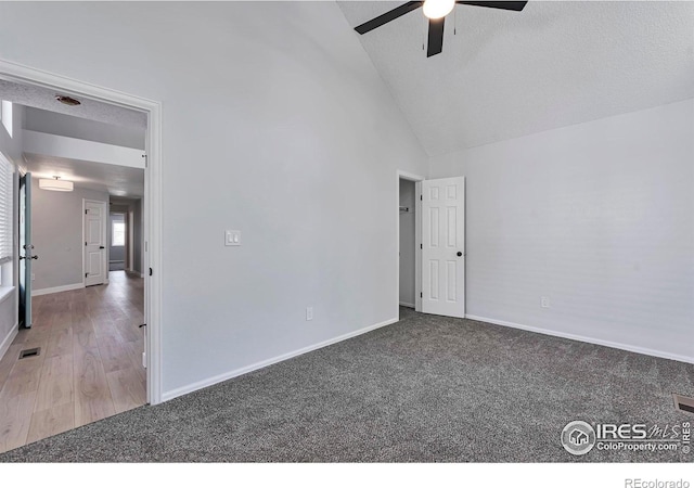 12525 E Tennessee Cir Unit E, Aurora, CO 80012 - carpeted empty room with ceiling fan, baseboards, and high vaulted ceiling