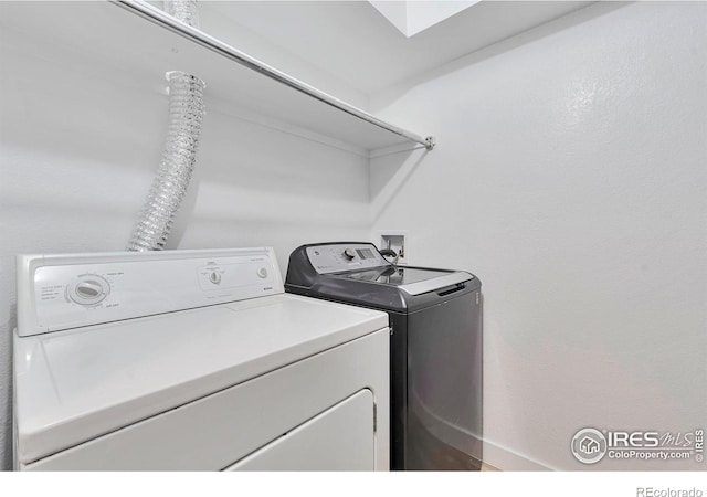 12525 E Tennessee Cir Unit E, Aurora, CO 80012 - laundry area featuring washer and clothes dryer