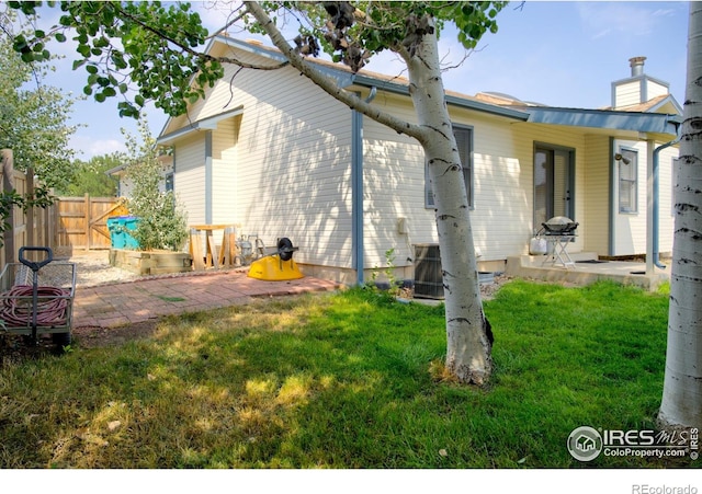 view of property exterior featuring a patio area and central AC