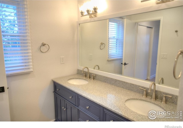 bathroom with double vanity