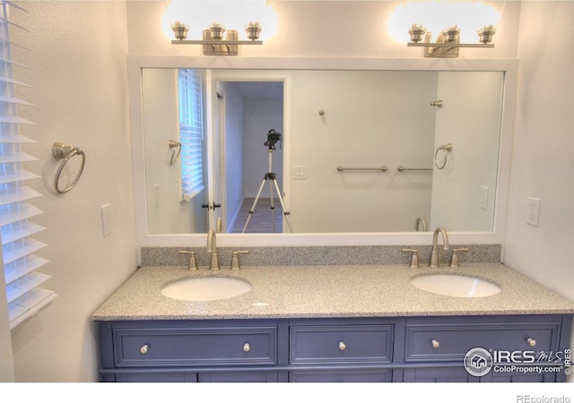 bathroom featuring double vanity