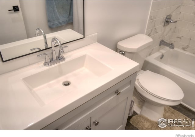 bathroom with vanity, toilet, and bathing tub / shower combination