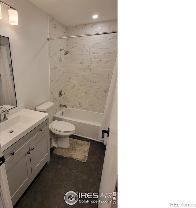 bathroom with tile patterned floors, shower / washtub combination, vanity, and toilet