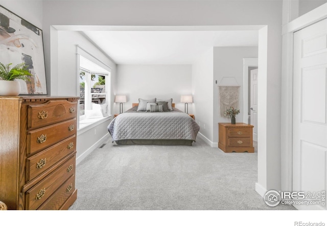 bedroom with carpet and baseboards