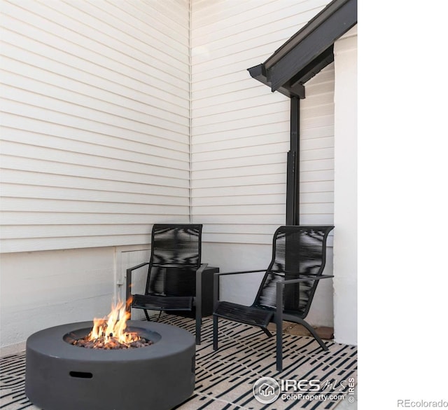 view of patio / terrace featuring a fire pit