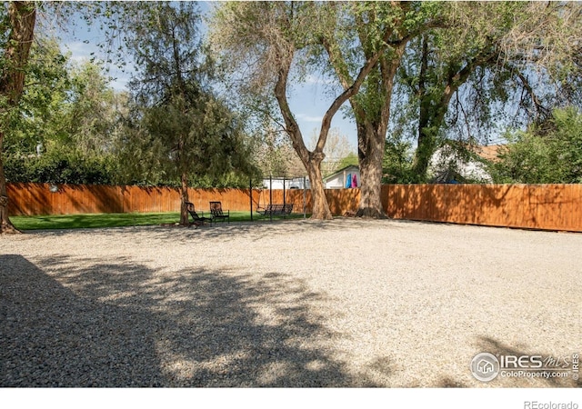view of yard with fence