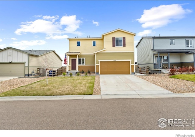 view of front facade with concrete driveway, a front yard, and an attached garage